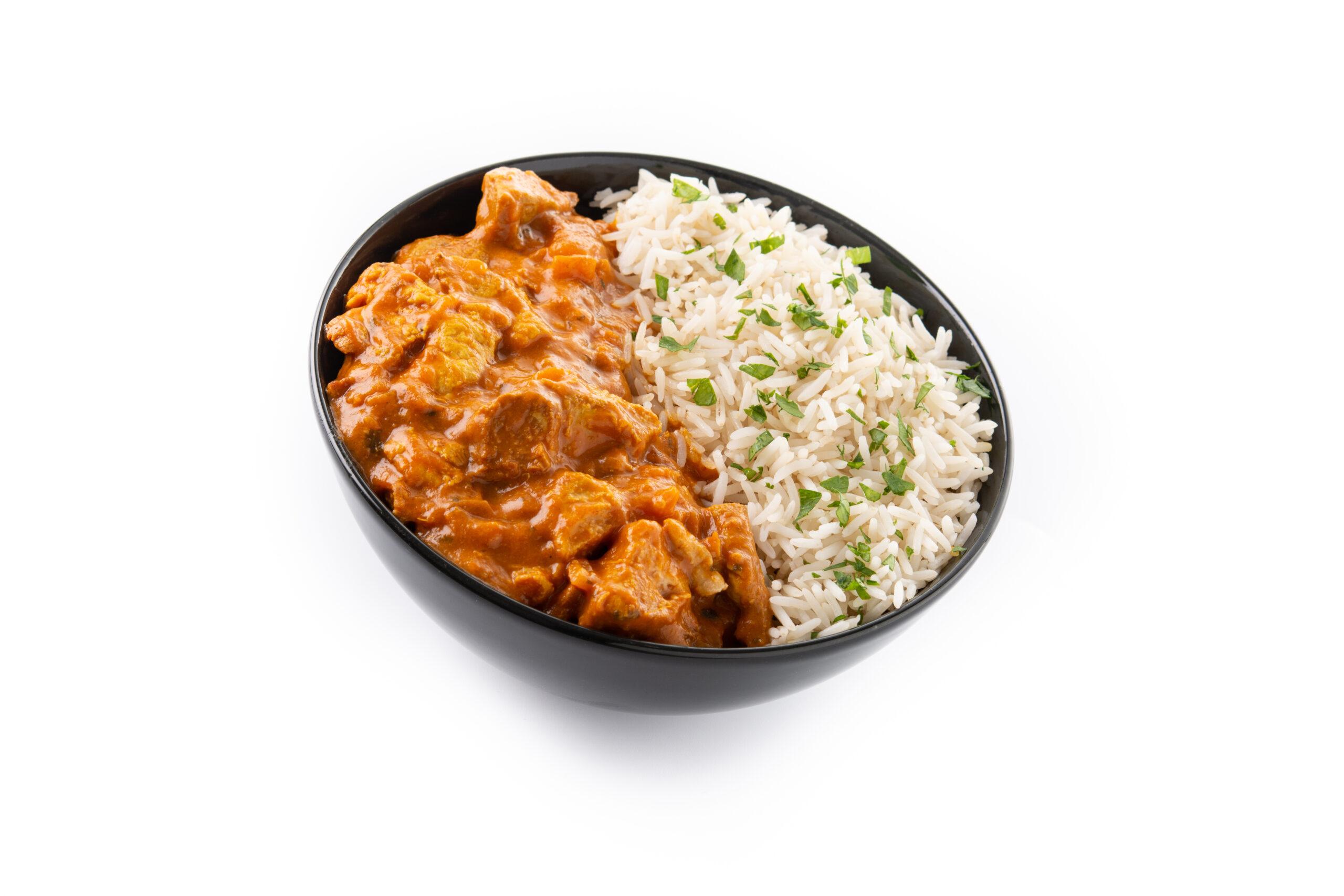 Indian butter chicken in black bowl